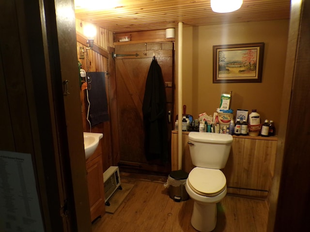 17 Kingsbury Rd, Wellington, ME 04942 - bathroom with toilet, wood finished floors, a stall shower, and wooden ceiling
