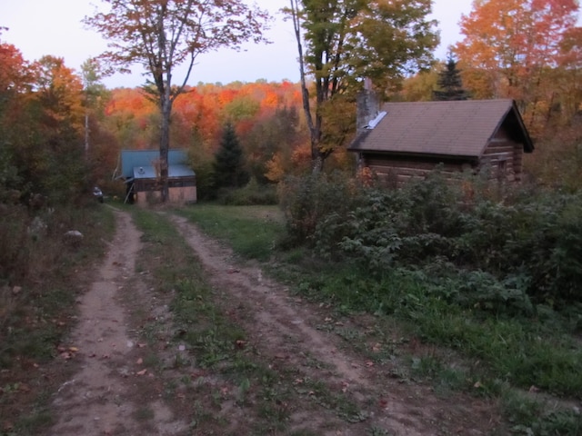 17 Kingsbury Rd, Wellington, ME 04942 - view of dirt / gravel road featuring a forest view