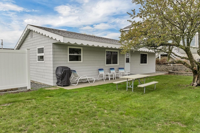 273 Webhannet Dr Unit 8, Wells, ME 04090 - rear view of property featuring roof with shingles and a patio