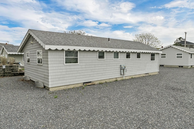 273 Webhannet Dr Unit 8, Wells, ME 04090 - back of property featuring roof with shingles
