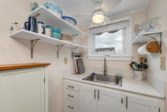 273 Webhannet Dr Unit 8, Wells, ME 04090 - kitchen with open shelves, a sink, crown molding, and light countertops