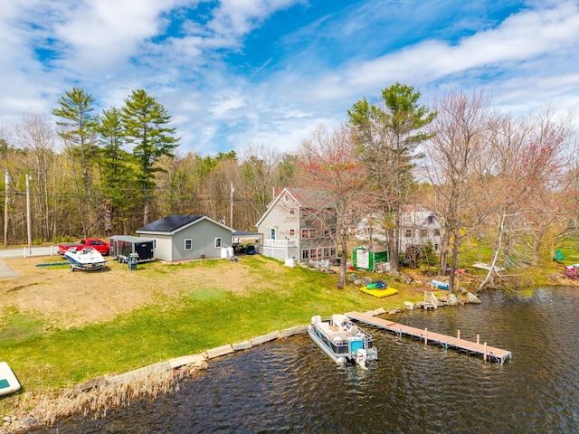 dock with a water view and a lawn
