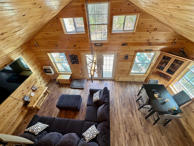 42 Cyrs Siding Rd, Saint Albans, ME 04971 - living area featuring a skylight, wooden walls, high vaulted ceiling, and wood finished floors