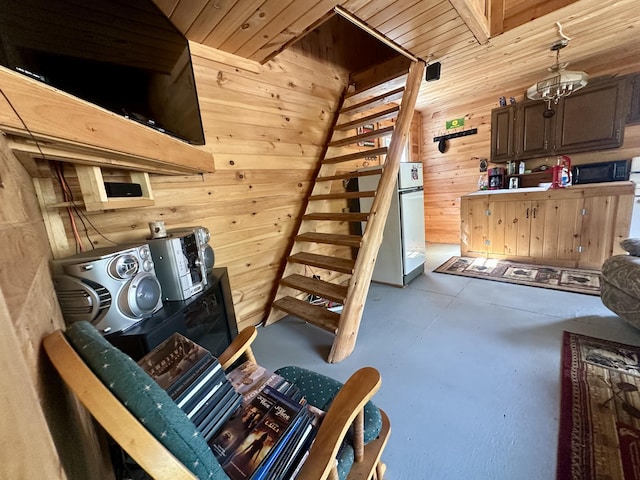 42 Cyrs Siding Rd, Saint Albans, ME 04971 - staircase with finished concrete floors and wood walls