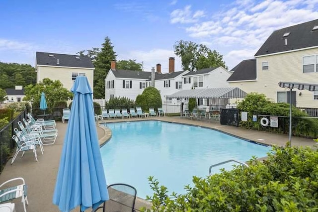 76 Post Rd Unit C9, Wells, ME 04090 - community pool featuring fence, a residential view, and a patio area