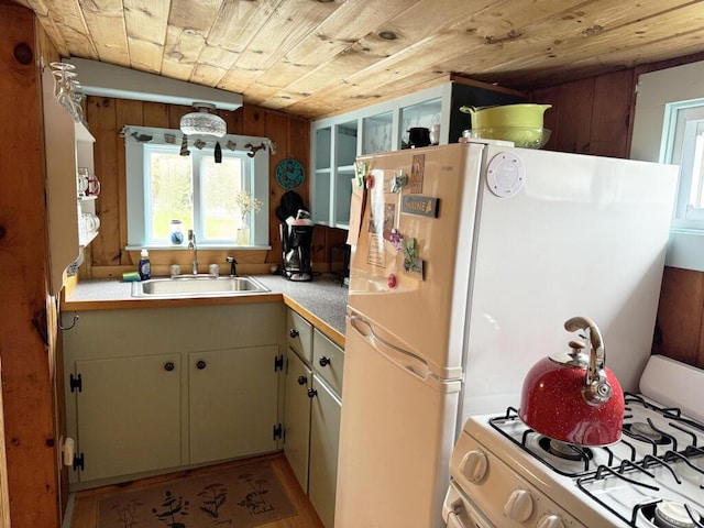 76 Post Rd Unit C9, Wells, ME 04090 - kitchen with a sink, white appliances, plenty of natural light, light countertops, and wooden ceiling