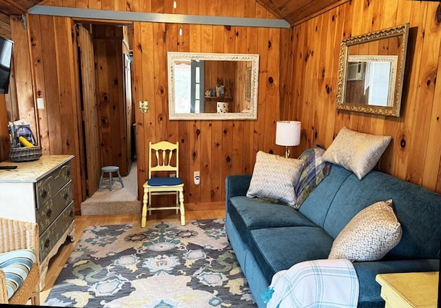 76 Post Rd Unit C9, Wells, ME 04090 - living room with lofted ceiling, wood finished floors, and wood walls