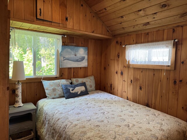 76 Post Rd Unit C9, Wells, ME 04090 - bedroom featuring multiple windows, vaulted ceiling, wood ceiling, and wooden walls