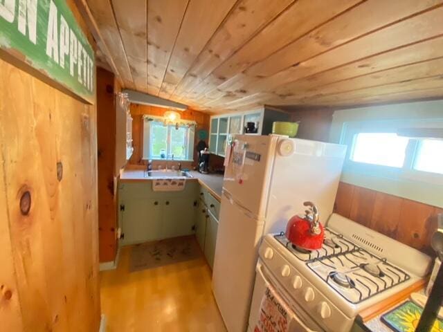 76 Post Rd Unit C9, Wells, ME 04090 - kitchen with gas range gas stove, wooden ceiling, and light wood finished floors