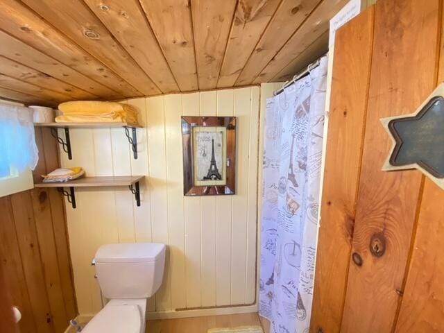 76 Post Rd Unit C9, Wells, ME 04090 - bathroom with wood ceiling, curtained shower, and wood walls
