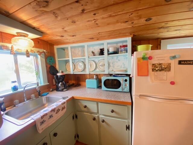 76 Post Rd Unit C9, Wells, ME 04090 - kitchen featuring freestanding refrigerator and wood ceiling