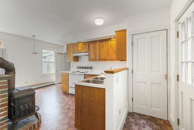 44 Pascal Ave, Rockport, ME 04856 - kitchen featuring electric stove, a wood stove, under cabinet range hood, brick patterned floors, and a baseboard heating unit