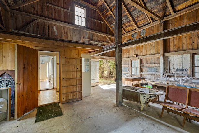44 Pascal Ave, Rockport, ME 04856 - misc room with unfinished concrete floors, lofted ceiling, and wooden walls