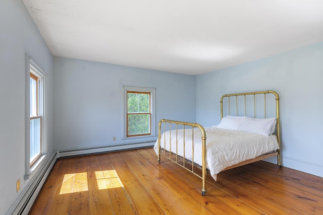 44 Pascal Ave, Rockport, ME 04856 - bedroom featuring a baseboard radiator and hardwood / wood-style flooring