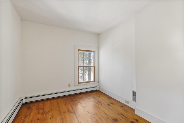 44 Pascal Ave, Rockport, ME 04856 - unfurnished room featuring a baseboard heating unit and light wood finished floors