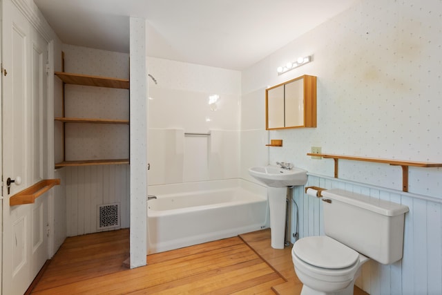 44 Pascal Ave, Rockport, ME 04856 - bathroom with wood finished floors, toilet, wallpapered walls, and shower / bath combination