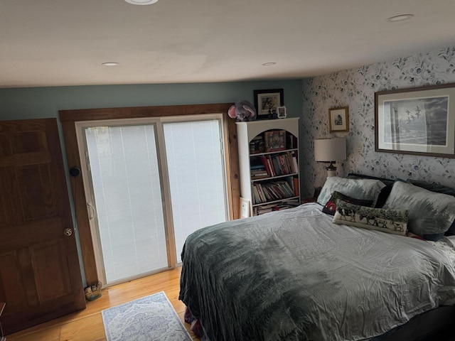 1363 Hallowell Rd, Litchfield, ME 04350 - bedroom featuring wallpapered walls and light wood finished floors