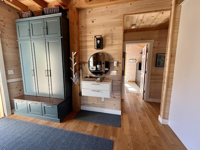 26 Hamilton Dr, Vinalhaven, ME 04863 - mudroom with wooden walls, light wood finished floors, and baseboards