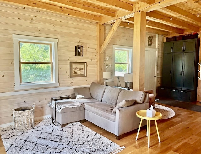 26 Hamilton Dr, Vinalhaven, ME 04863 - living room featuring wooden walls, beamed ceiling, wood finished floors, and wooden ceiling
