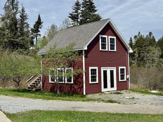 26 Hamilton Dr, Vinalhaven, ME 04863 - view of side of home with french doors and stairs