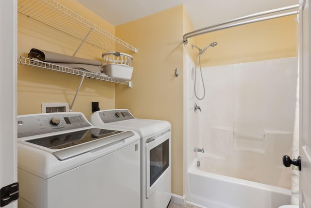 washroom featuring washer and clothes dryer