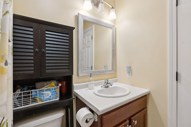 bathroom with vanity and toilet