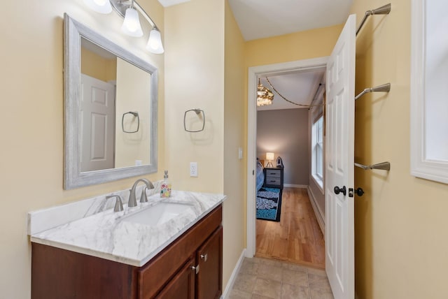 bathroom with vanity and baseboards