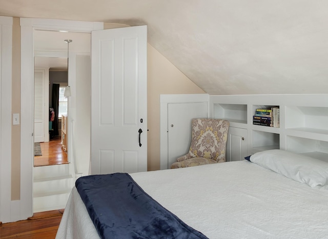 63 Fletcher St, Kennebunk, ME 04043 - bedroom featuring dark wood-style flooring and lofted ceiling