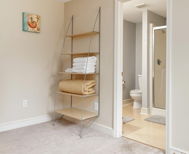 63 Fletcher St, Kennebunk, ME 04043 - full bathroom featuring a shower stall, toilet, and baseboards