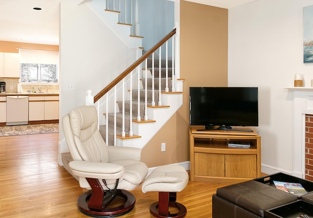 63 Fletcher St, Kennebunk, ME 04043 - living room featuring light wood-type flooring, stairway, and baseboards