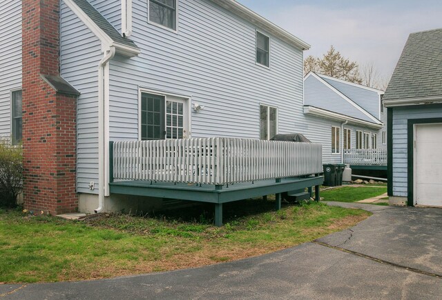 63 Fletcher St, Kennebunk, ME 04043 - view of side of home featuring a wooden deck and a garage