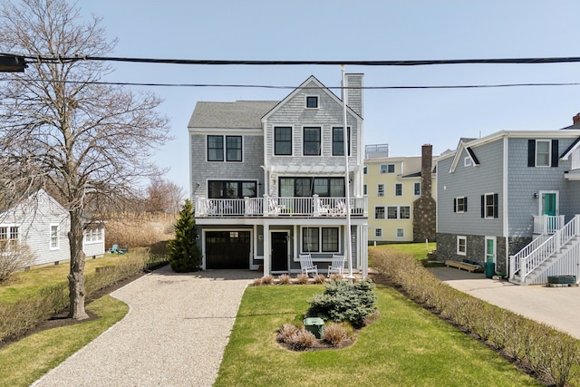 1 Harris Ln, Kennebunk, ME 04043 - view of front of home with gravel driveway, a chimney, an attached garage, and a front yard