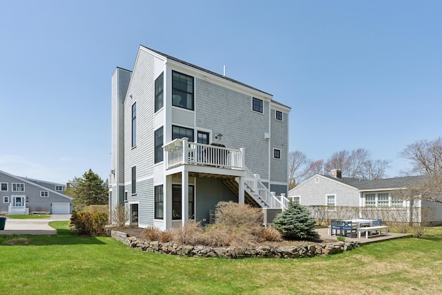 1 Harris Ln, Kennebunk, ME 04043 - rear view of house featuring a yard, stairs, and a wooden deck