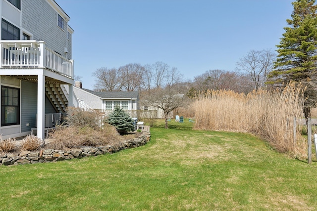 1 Harris Ln, Kennebunk, ME 04043 - view of yard with stairway, a wooden deck, and central AC unit
