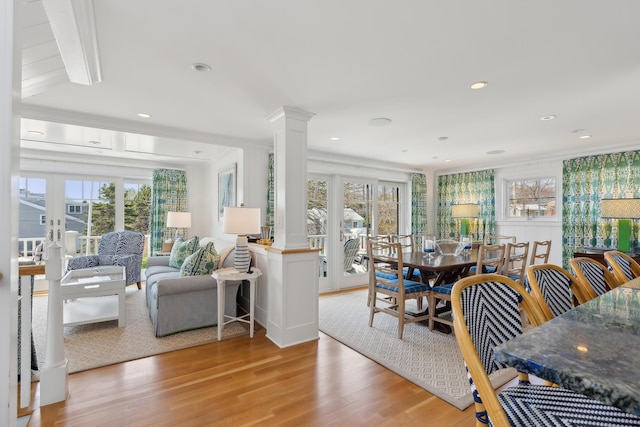 1 Harris Ln, Kennebunk, ME 04043 - dining space with light wood-type flooring, a healthy amount of sunlight, and decorative columns