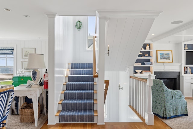 1 Harris Ln, Kennebunk, ME 04043 - stairway with a fireplace, built in features, and wood finished floors