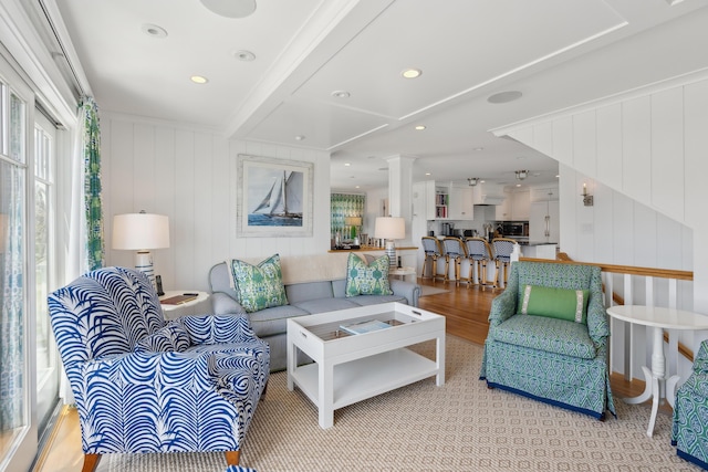 1 Harris Ln, Kennebunk, ME 04043 - living room with a decorative wall, beam ceiling, and light wood-style flooring