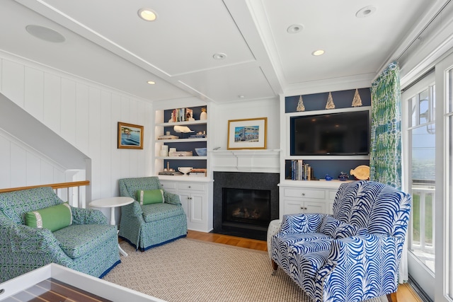 1 Harris Ln, Kennebunk, ME 04043 - living area featuring plenty of natural light, wood finished floors, a fireplace with flush hearth, and recessed lighting