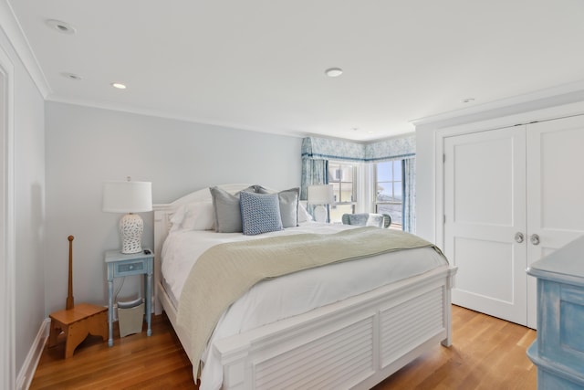1 Harris Ln, Kennebunk, ME 04043 - bedroom featuring crown molding, light wood-style floors, and a closet
