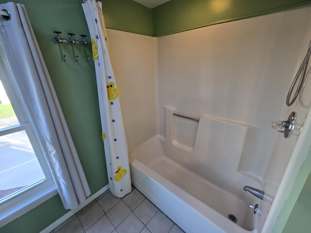 full bath featuring tile patterned floors and shower / bath combo