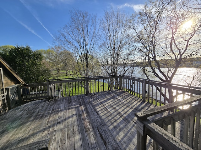 wooden deck with a water view