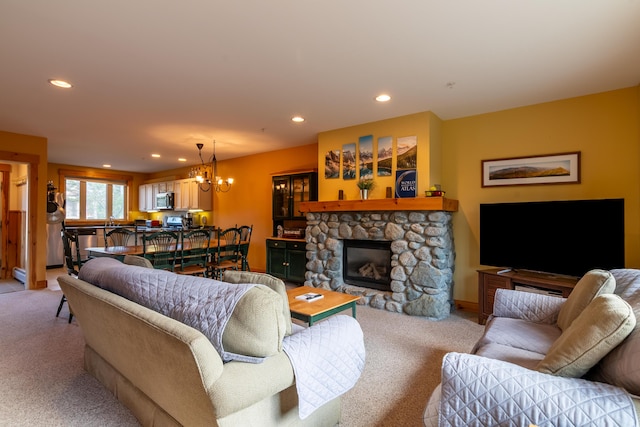 living room with a chandelier, light carpet, and recessed lighting