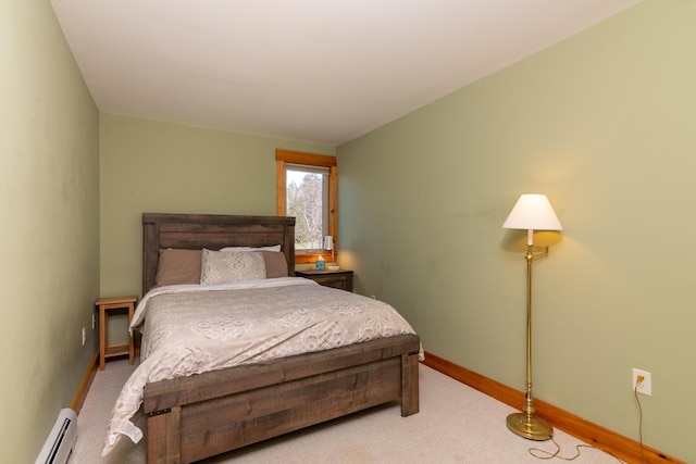 carpeted bedroom featuring baseboards and baseboard heating