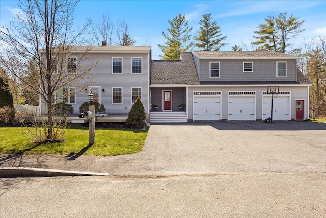 140 Pennell Ave, Portland, ME 04103 - view of front of home with driveway, an attached garage, and a shingled roof