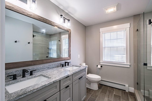 full bath featuring a baseboard heating unit, a stall shower, toilet, and wood tiled floors
