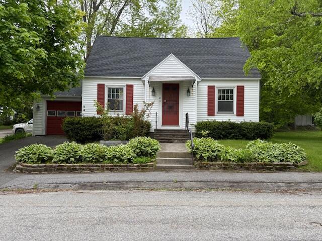 16 Congress St, Augusta, ME 04330 - view of front of property with driveway, an attached garage, and a shingled roof