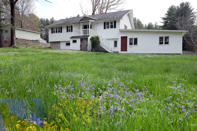 view of front of house featuring stairway and a chimney