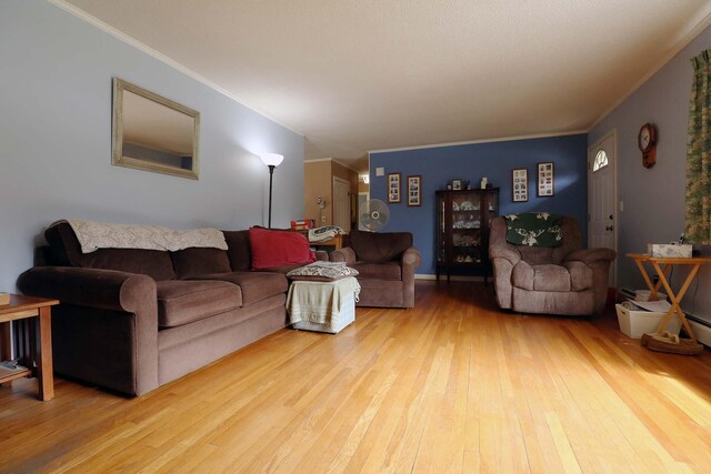 living room featuring hardwood / wood-style floors and crown molding