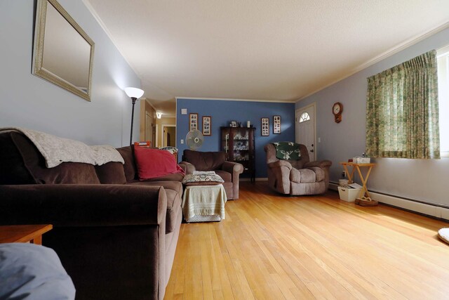 living room featuring light wood-style floors and ornamental molding