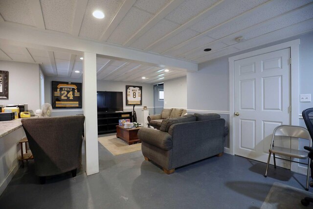 living area featuring concrete flooring and recessed lighting